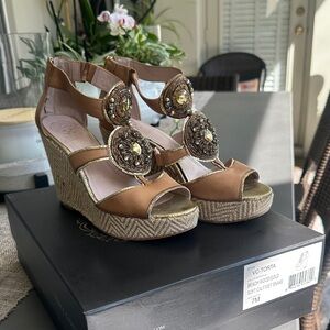 Vince Camuto Tan Wedge Sandals with Gold Medallions. Leather upper manage sole.
